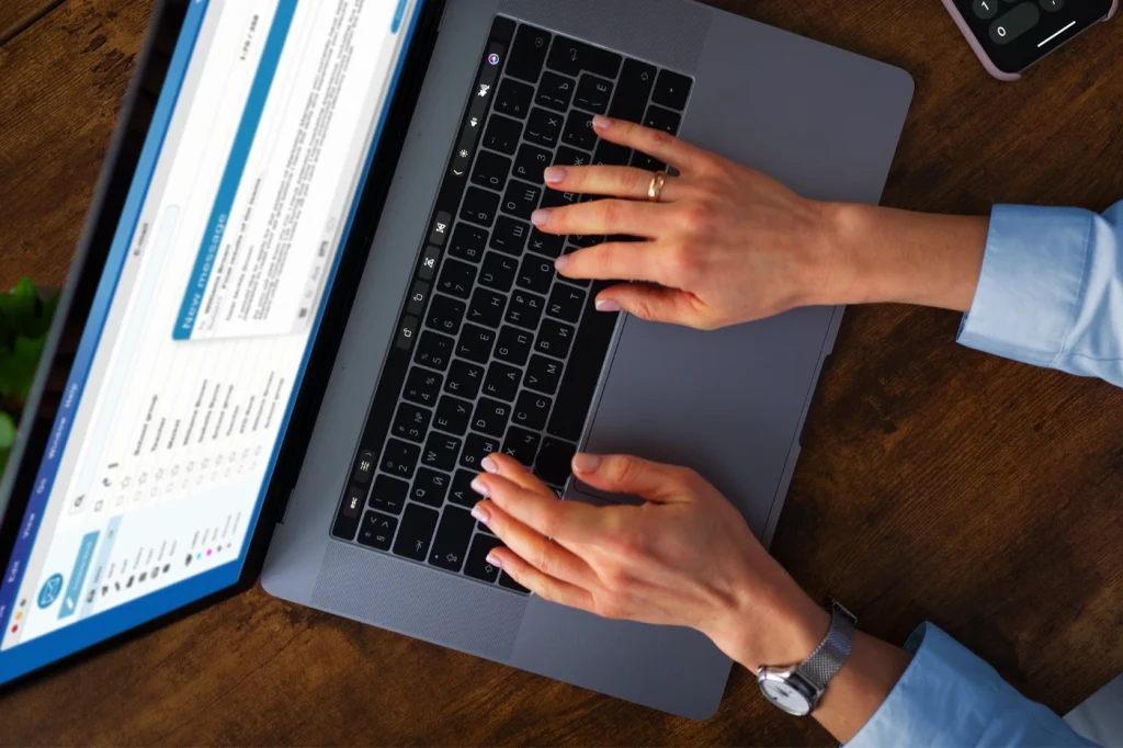 Business professional working on a laptop with Salesforce account planning tools, illustrating challenges of using CRM for key account management.